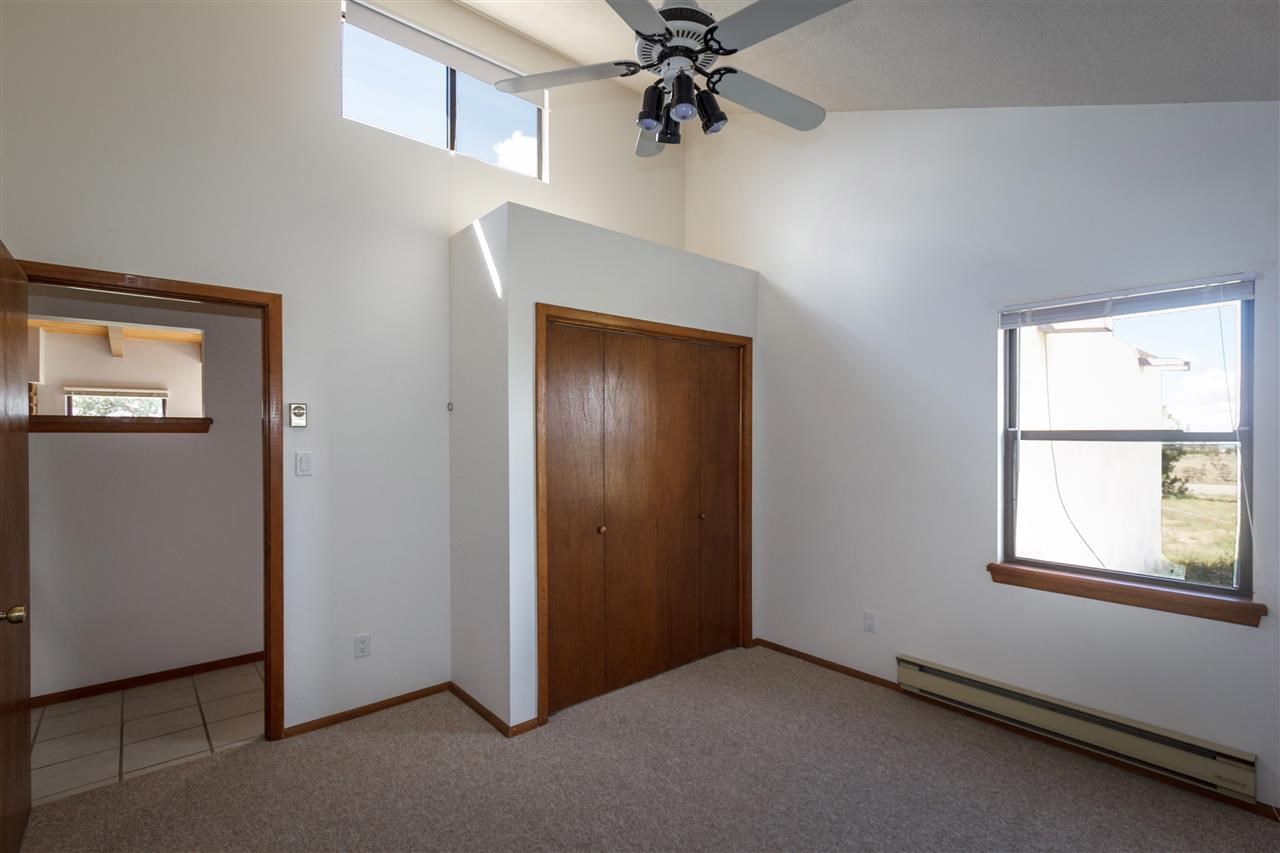 21 Azul Loop Santa Fe Nm 87508 Mls 201704984 Bell Tower Bright And Light With Clerestory Vaulted Ceilings In The North Bedroom Vertical Adobe Walls On Southside Of Great Room